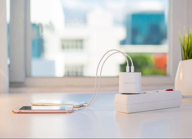 Įkroviklis Ugreen CD104 2xUSB-A 2.4A baltas
